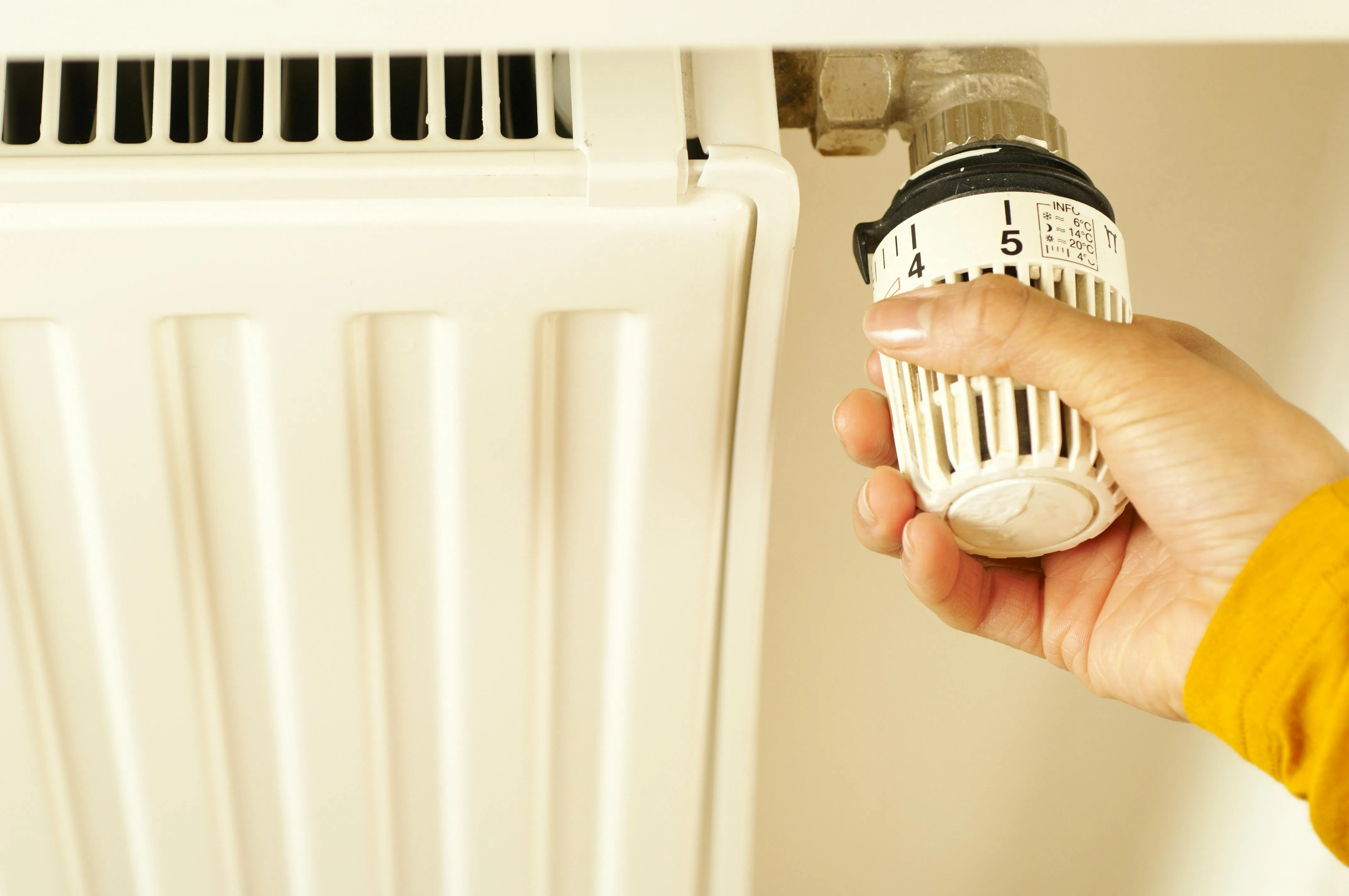 A heating engineer at work on a heat pump installation