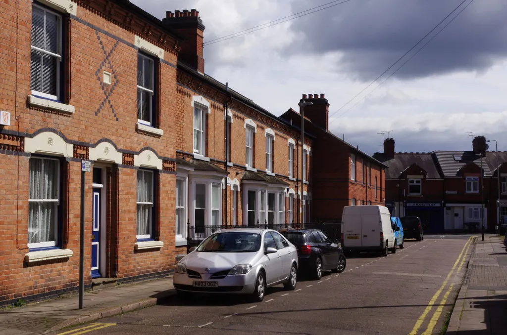 A red-brick Victorian terrace on a Stoneygate side street with painted cream window dressings and decorative brickwork — heritage stock representative of the period architecture found across older Leicester neighbourhoods.
